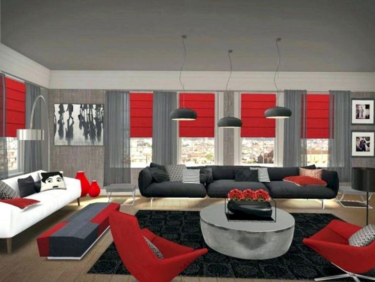 Czerwone rolety i fotele w salonie